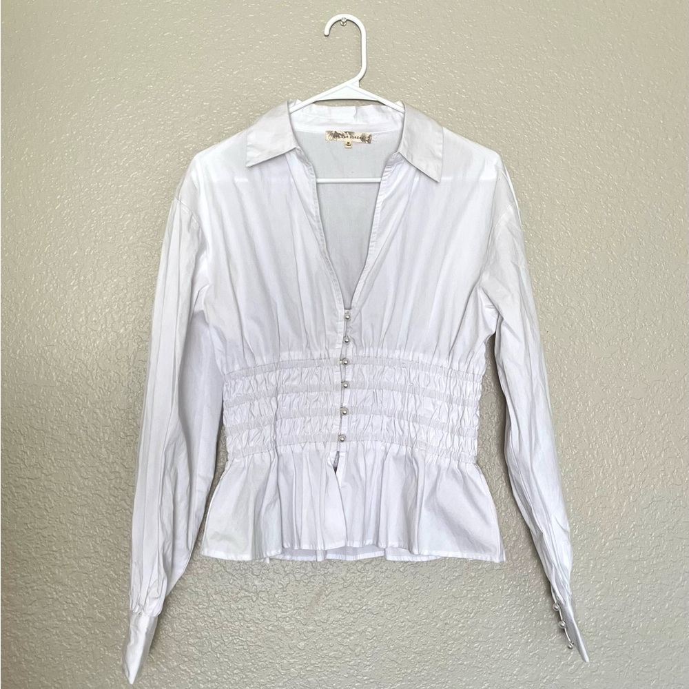 White peplum top with pearls